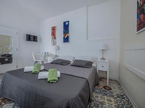 Valletta Ajkla Mansion tesisinde bir odada yatak veya yataklar