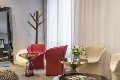 Ein Sitzbereich in der Unterkunft Best Western Plus La Demeure