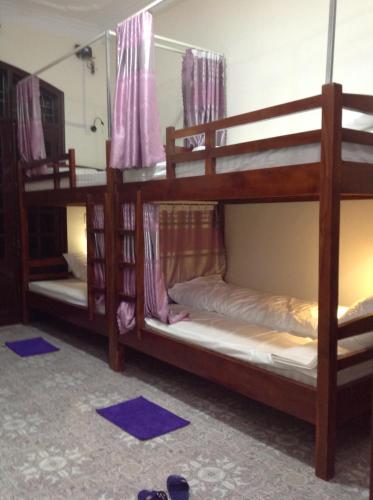 Ha Giang 1 Hostel and Loop Tourにあるベッド