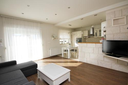 Kuchyň nebo kuchyňský kout v ubytování Apartmani Šulenta