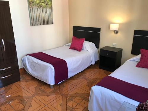 Letto o letti in una camera di Hotel Tito