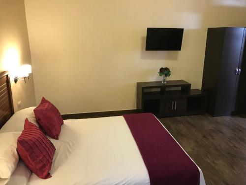 Letto o letti in una camera di Hotel Tito