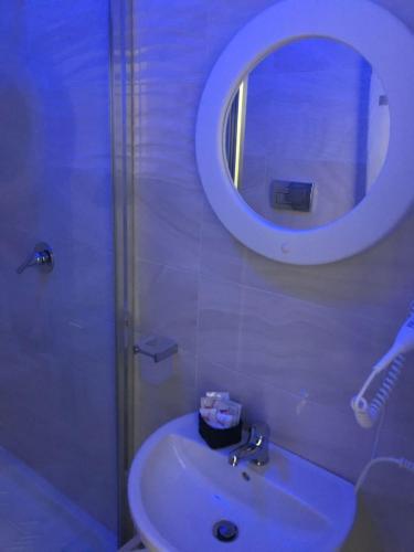 a bathroom with a sink and a mirror at Ville Vesuviane in San Giorgio a Cremano