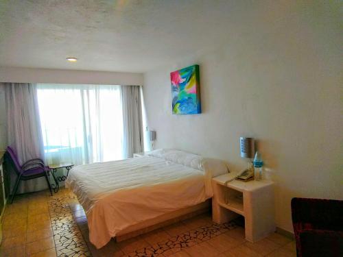 Ένα ή περισσότερα κρεβάτια σε δωμάτιο στο Hotelito Escondido