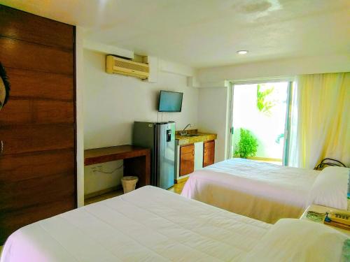 Ένα ή περισσότερα κρεβάτια σε δωμάτιο στο Hotelito Escondido