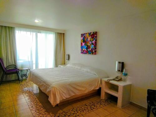 Ένα ή περισσότερα κρεβάτια σε δωμάτιο στο Hotelito Escondido
