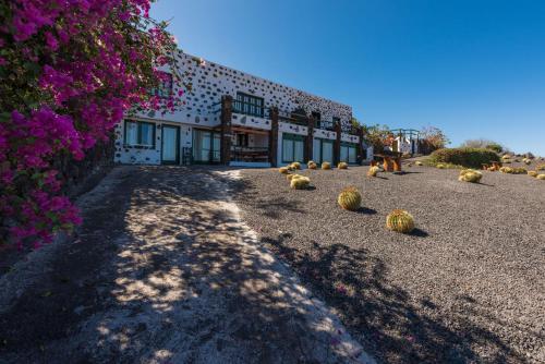 a building with hay bales on the ground at La Brujita in Frontera