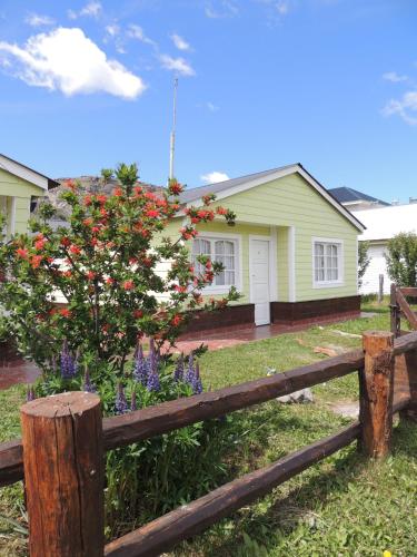 a wooden fence in front of a house at Complejo "Nahuel Pan " in El Chalten