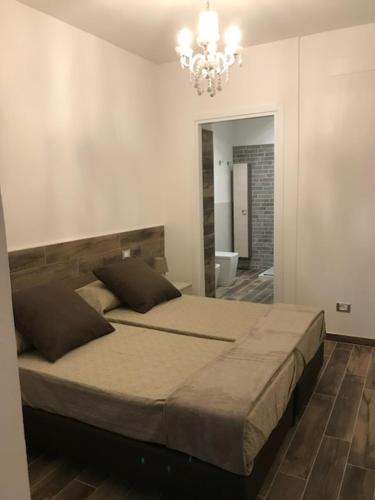 Кровать или кровати в номере B&B Fiera Maglo'