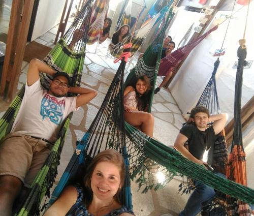 a group of people sitting in hammocks at Casamatta Hostel in Pirenópolis