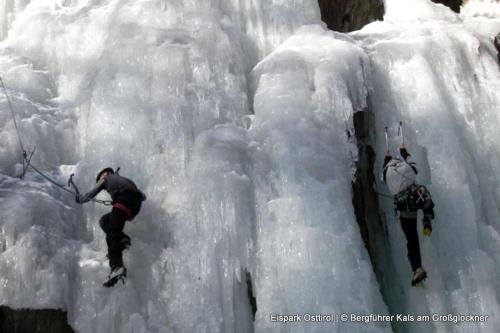 two people are on an ice wall at Ferienhaus Posthüttl in Virgen