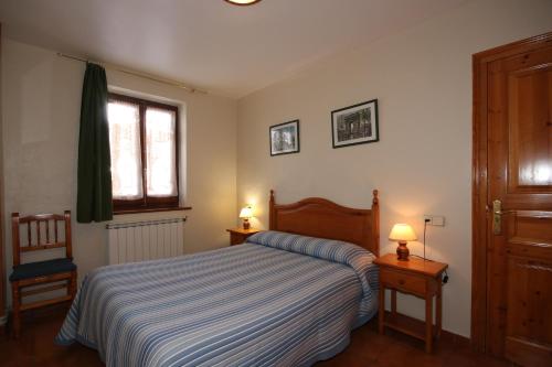 Ένα ή περισσότερα κρεβάτια σε δωμάτιο στο Hotel Seixes y Apartamento Bagergue
