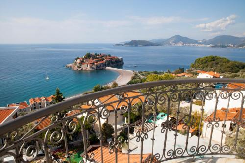 a view of the ocean from a balcony at Villa Edelweiss in Sveti Stefan