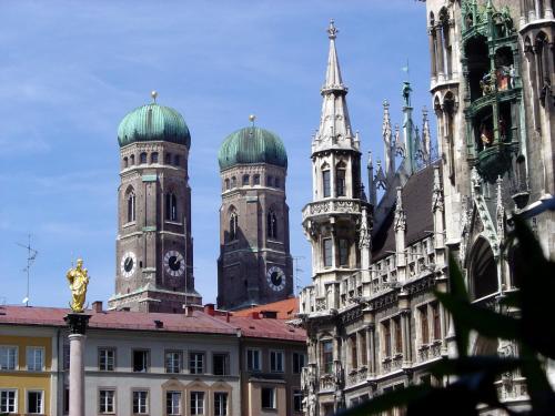 a group of buildings with domes on top of them at Landgasthof zum Brückenwirt in Starnberg