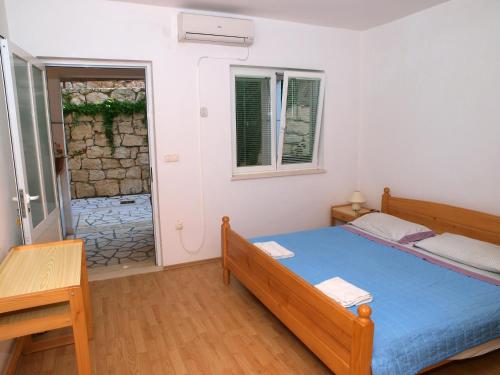 A bed or beds in a room at Apartments Adriatic