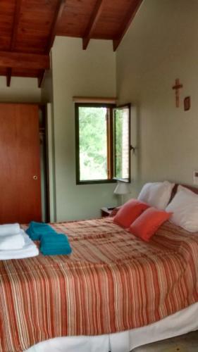 Un pat sau paturi într-o cameră la Chalets Andalgala