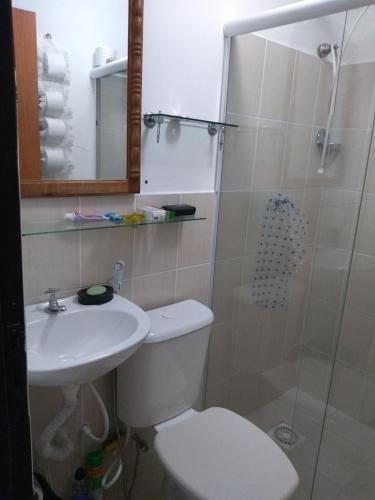 a bathroom with a toilet and a sink and a shower at Pedra Do Imperador in Nova Friburgo