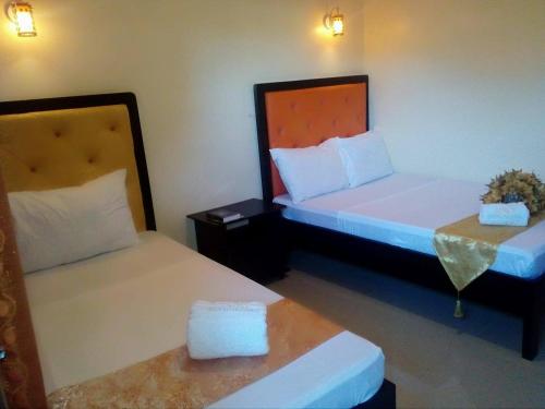 Ένα ή περισσότερα κρεβάτια σε δωμάτιο στο RSG Microhotel