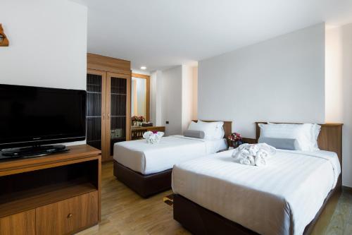 Letto o letti in una camera di Aiyara Palace
