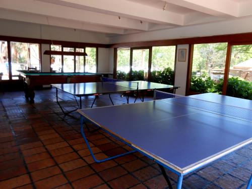 a group of ping pong tables in a room at Rincon del Este Resort in Punta del Este