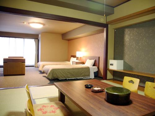 Una cama o camas en una habitación de Hotel Kirishima Castle