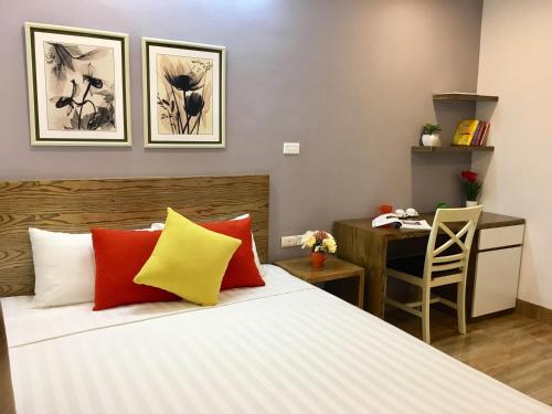 Ένα ή περισσότερα κρεβάτια σε δωμάτιο στο V House 5 Serviced Apartment