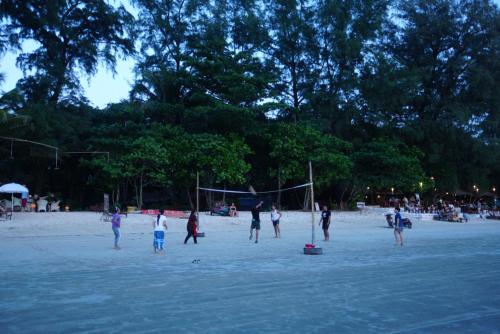 people playing a game of soccer at Bamboo Bungalows in Ko Phayam