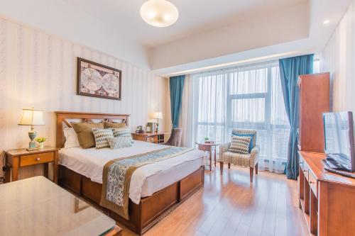 a hotel room with a bed and a large window at Westlake 7 Service Apartment in Hangzhou