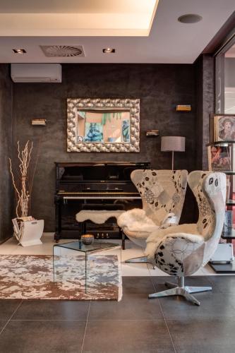 a living room with two chairs and a piano at Best Western Hotel Vista in Ostrava