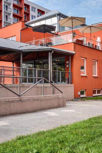 a building with an umbrella on top of it at Best Western Hotel Vista in Ostrava
