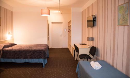 Postel nebo postele na pokoji v ubytování Hotell Tamula