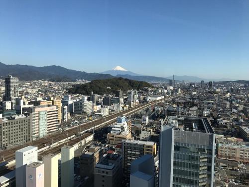 an aerial view of a city with a bridge at HOTEL GRAND HILLS SHIZUOKA in Shizuoka