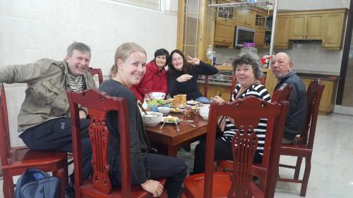 a group of people sitting around a table at Duong Ha Hotel in Cao Bằng