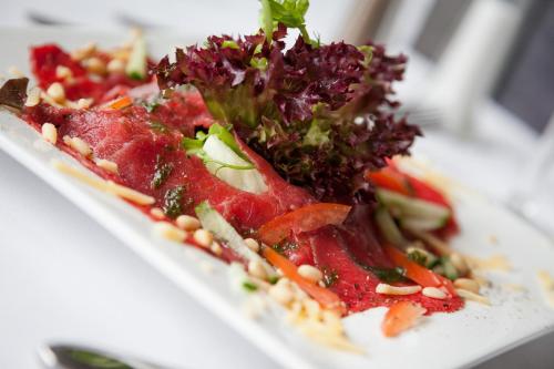 a plate of food on a white plate at Hotel Beemster in Middenbeemster