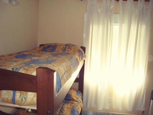 Postel nebo postele na pokoji v ubytování Departamentos Las Grutas Enjoy