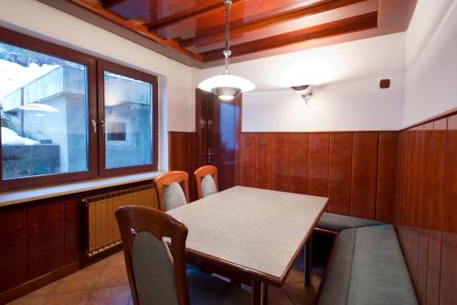 a dining room with a table and chairs at Vila Lipa in Bled