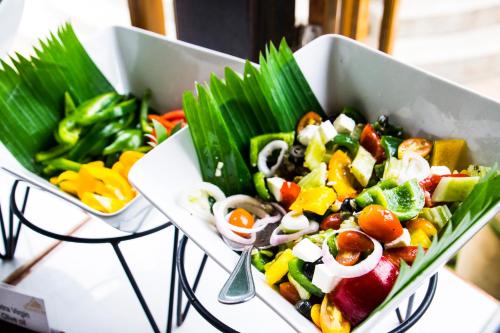 a salad in a white bowl on a table at Thai House Beach Resort in Lamai