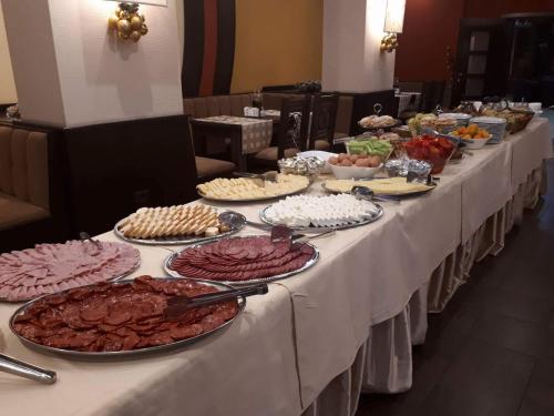 a long table filled with different types of food at Sunrise Park Hotel Bansko - Free Wellness in Bansko