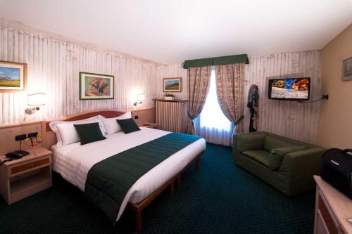 Letto o letti in una camera di Hotel Alpina