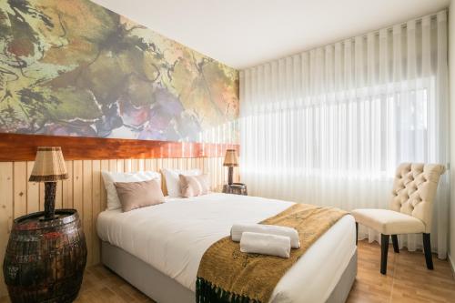 Camarinha Oporto Apartments tesisinde bir odada yatak veya yataklar