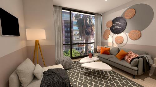 Great Living Apartments tesisinde bir odada yatak veya yataklar