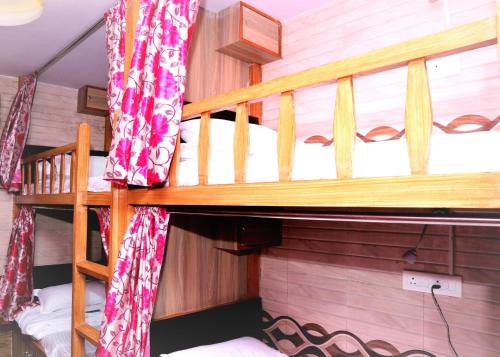 a couple of bunk beds in a room at Delta Dormitory in Mumbai