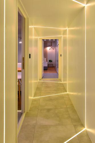 an empty hallway with white walls and a long corridor at Walk Inn Váci 78 in Budapest