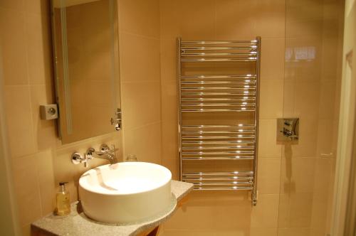 a bathroom with a sink and a shower at Chalet Oryx in Chamonix-Mont-Blanc