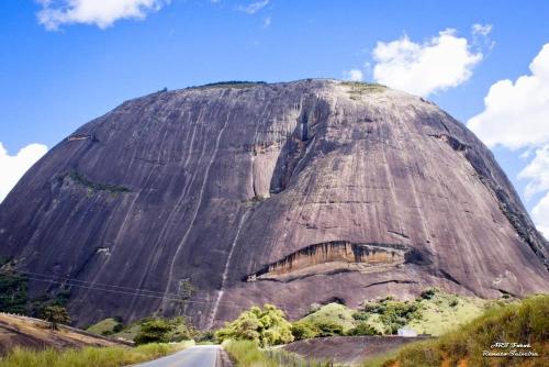 a large rock on the side of a road at Pousada Vale Encantado in Serra de São Bento