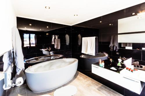 A bathroom at Townhouse Calvari By homevillas360