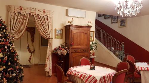 a living room with a christmas tree and a staircase at Hotel Cardinal in Aix-en-Provence