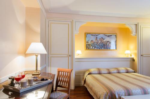 Postel nebo postele na pokoji v ubytování Hotel Tuder