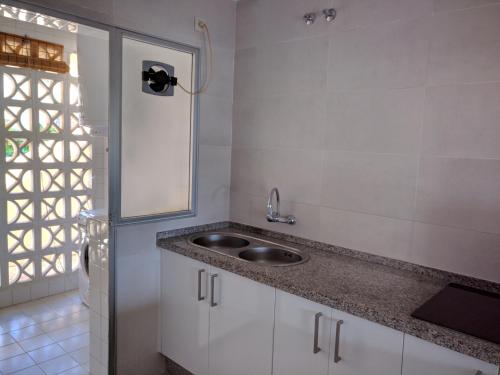 a kitchen with a sink and a window at Calahonda Buenavista in Mijas Costa