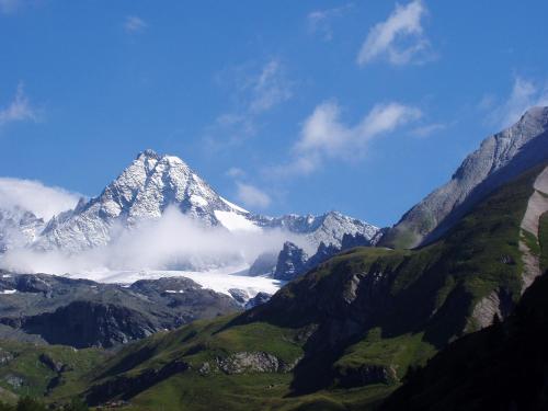 a snow covered mountain in the middle of a valley at Hoazhof in Kals am Großglockner